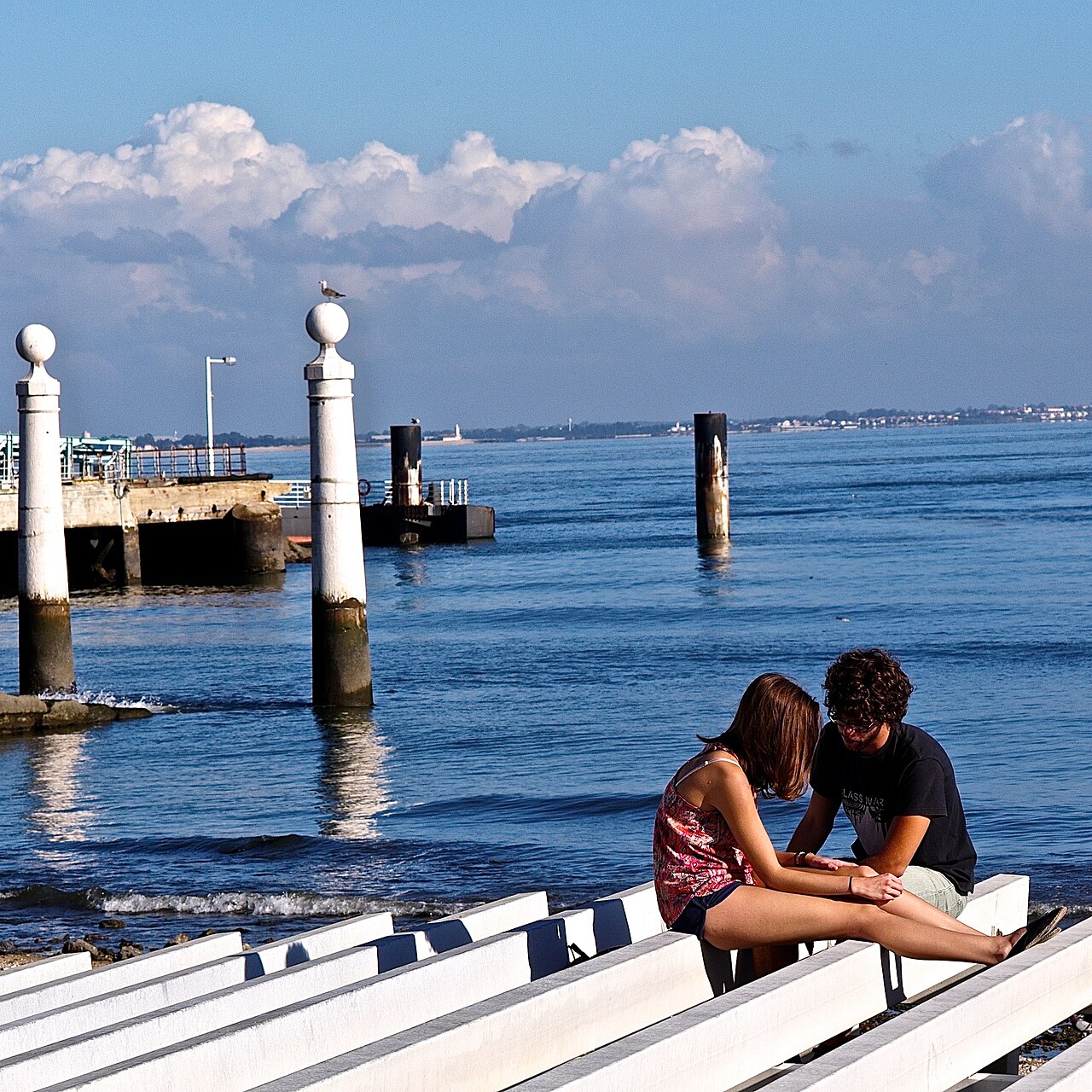 Two adults talking closely during a thoughtful conversation
