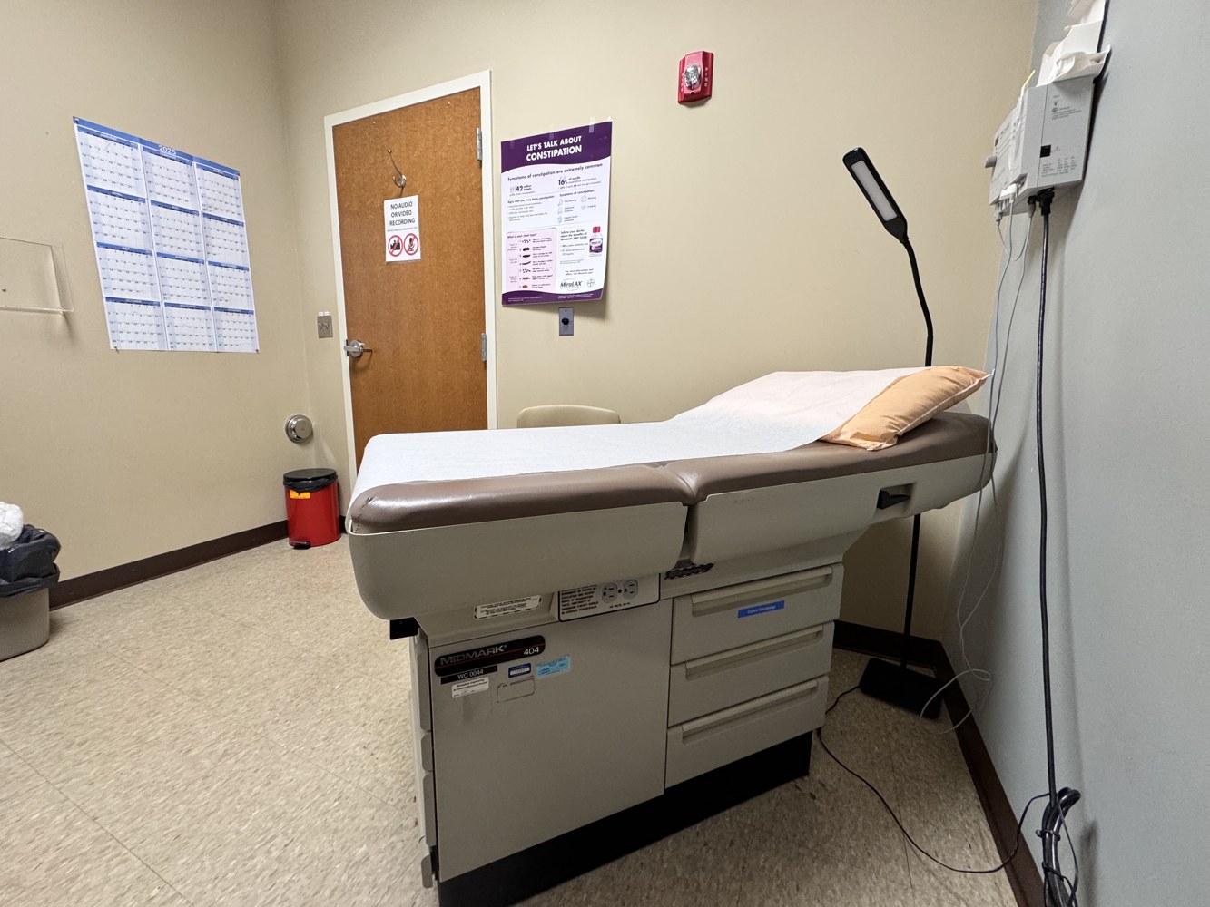 A typical examination room and exam table in a doctor's office. 02